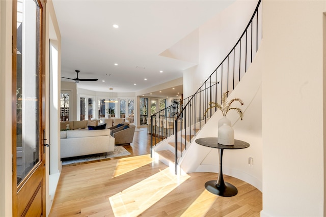 entryway featuring stairs, recessed lighting, and wood finished floors