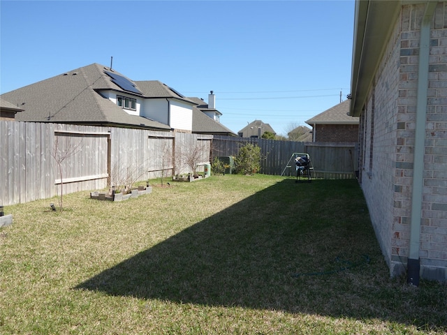 view of yard featuring a fenced backyard