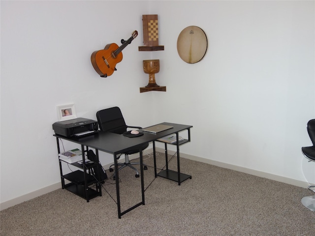 carpeted office featuring baseboards