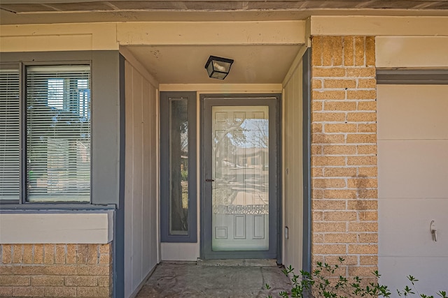 entrance to property with brick siding