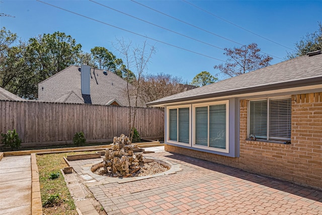 view of patio featuring fence