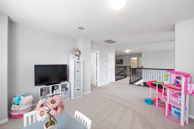 playroom featuring visible vents, baseboards, and carpet