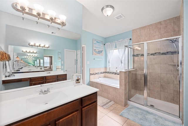 full bathroom featuring tile patterned floors, visible vents, a garden tub, and a shower stall