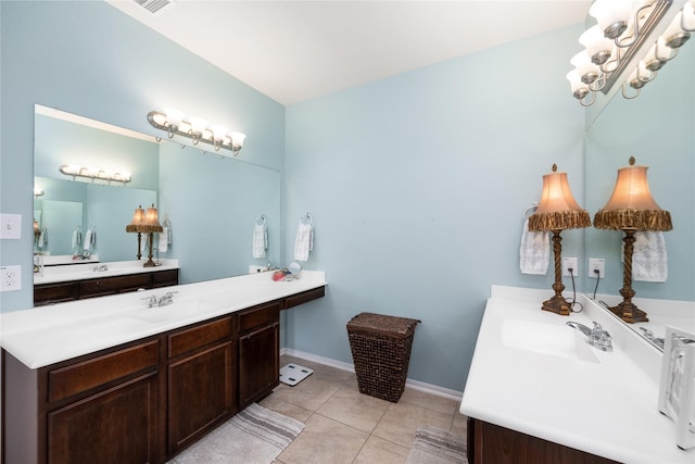 bathroom featuring vanity, a notable chandelier, baseboards, and tile patterned flooring