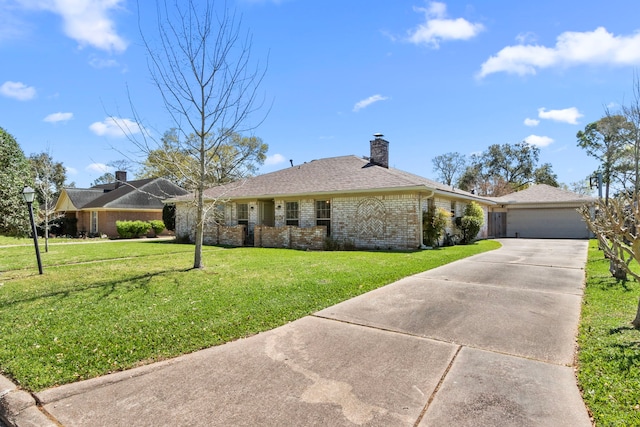 ranch-style home with brick siding, an attached garage, a front yard, a chimney, and driveway