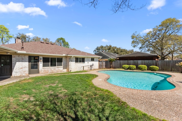 view of pool featuring a fenced in pool, a lawn, and a fenced backyard