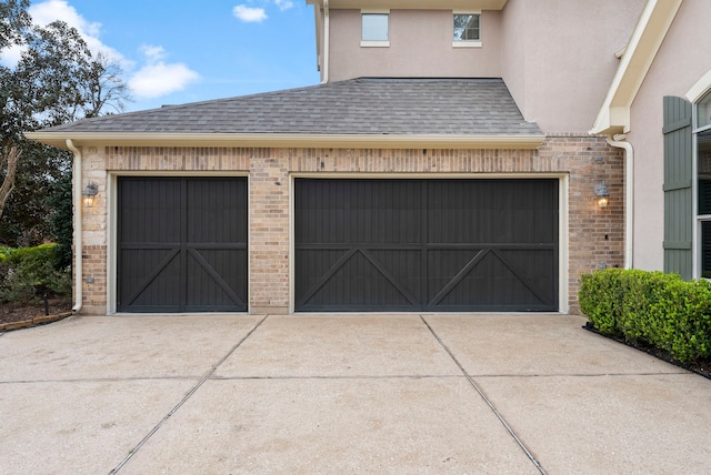 garage with concrete driveway