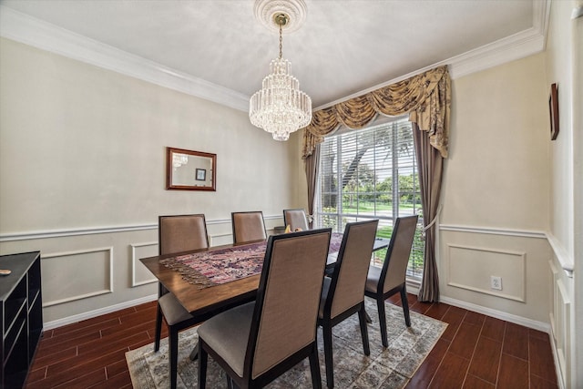 dining area featuring wood finish floors, a notable chandelier, and ornamental molding