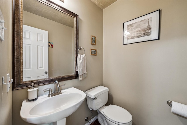 bathroom featuring a sink and toilet