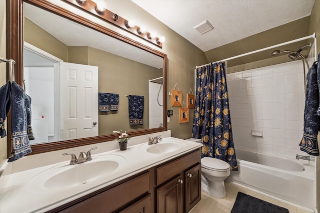 full bathroom featuring a sink, visible vents, a textured ceiling, and tile patterned flooring