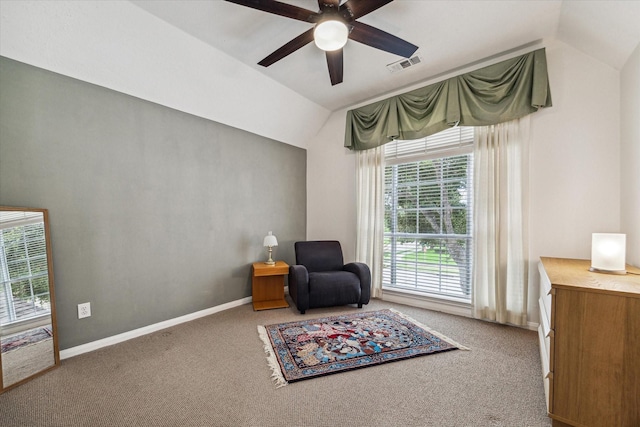 sitting room featuring visible vents, baseboards, carpet, lofted ceiling, and ceiling fan