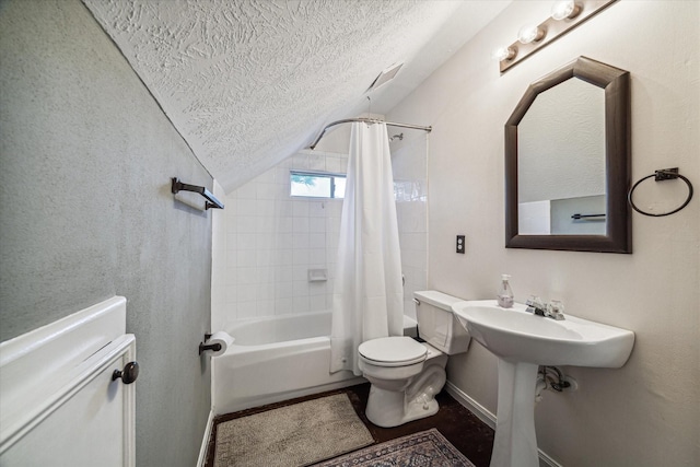 bathroom with baseboards, toilet, vaulted ceiling, shower / tub combo, and a textured ceiling