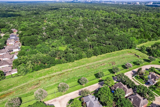 aerial view featuring a wooded view