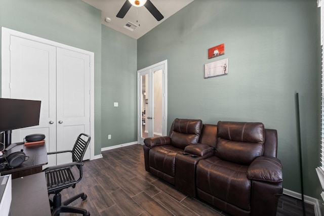 office area with visible vents, high vaulted ceiling, dark wood finished floors, baseboards, and ceiling fan