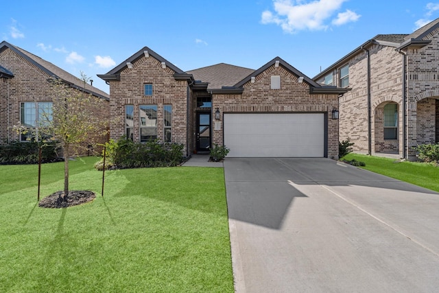 view of front of house featuring brick siding, an attached garage, and a front yard