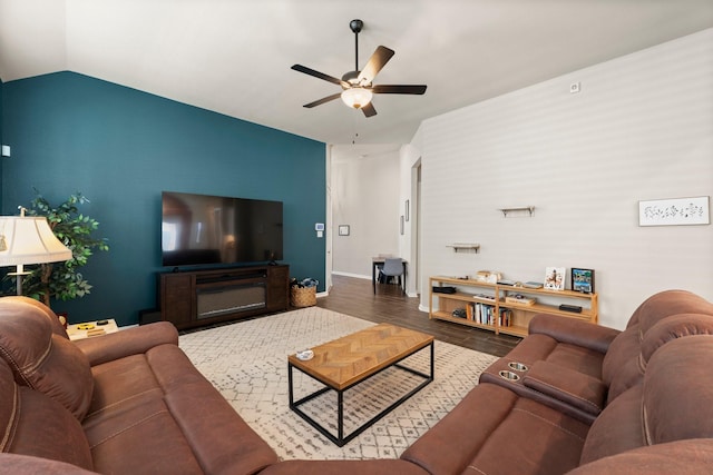 living room featuring ceiling fan, baseboards, lofted ceiling, and wood finished floors