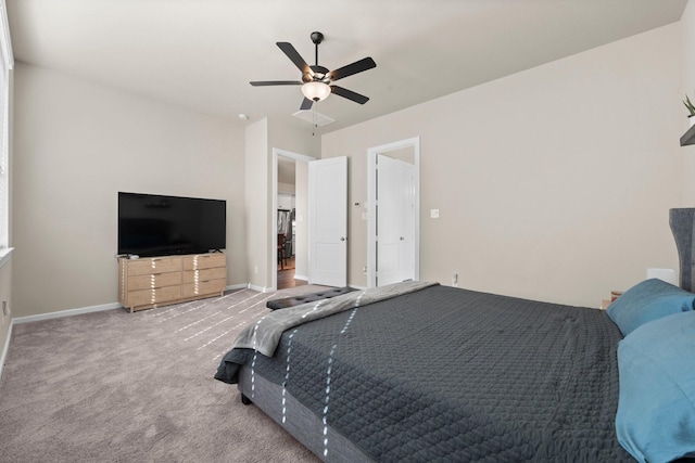 bedroom featuring baseboards, carpet floors, and a ceiling fan