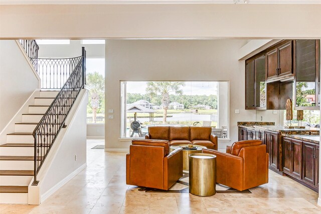 18752 Palm Beach Blvd, Montgomery, TX 77356 - living room with stairway, baseboards, and light tile patterned floors
