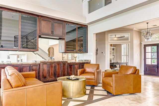18752 Palm Beach Blvd, Montgomery, TX 77356 - living room with stairs, crown molding, and a chandelier