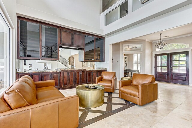 18752 Palm Beach Blvd, Montgomery, TX 77356 - living room with ornamental molding, light tile patterned floors, a chandelier, and french doors
