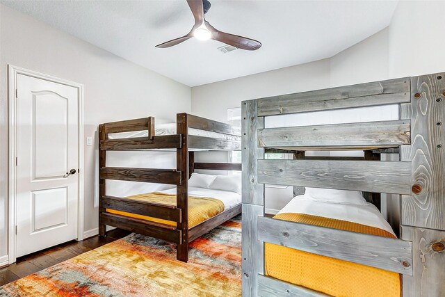 18752 Palm Beach Blvd, Montgomery, TX 77356 - bedroom with wood finished floors, baseboards, and a ceiling fan