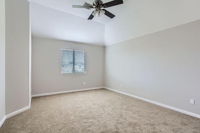 carpeted empty room with baseboards, lofted ceiling, and ceiling fan