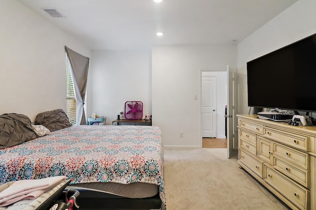 bedroom featuring light carpet, visible vents, and recessed lighting