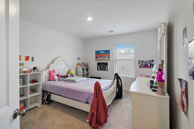 bedroom featuring recessed lighting, visible vents, and light carpet