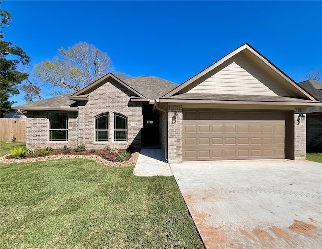 single story home with a front lawn, brick siding, and driveway