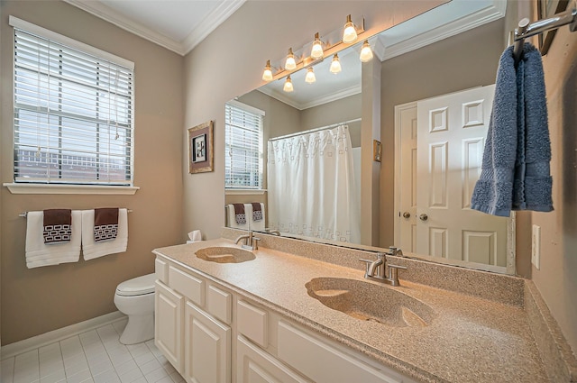 full bathroom with toilet, ornamental molding, and a sink