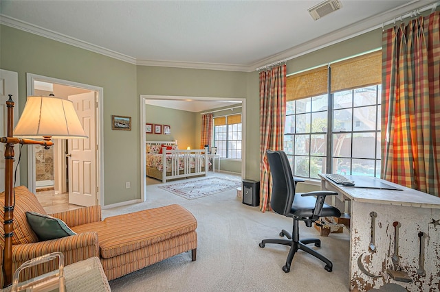 carpeted office space featuring visible vents, crown molding, and baseboards