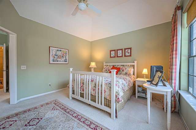 bedroom with carpet flooring, multiple windows, a ceiling fan, and baseboards