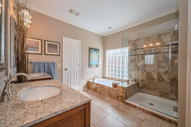 full bathroom featuring vanity, a garden tub, visible vents, a shower stall, and crown molding