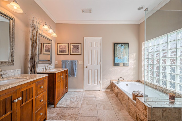 bathroom with visible vents, crown molding, a garden tub, and a sink