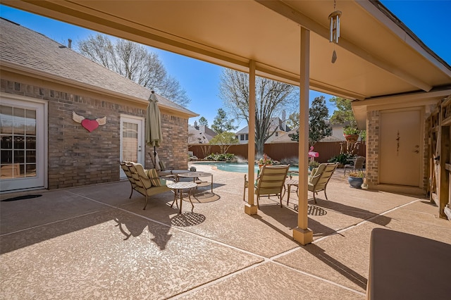 view of patio featuring a fenced in pool and a fenced backyard