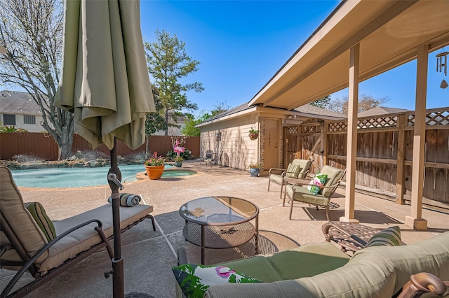 view of patio with a fenced backyard, a fenced in pool, and an outdoor hangout area