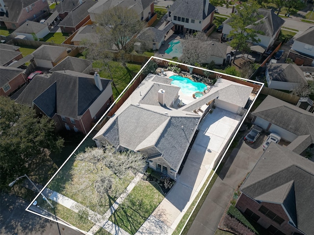 birds eye view of property with a residential view