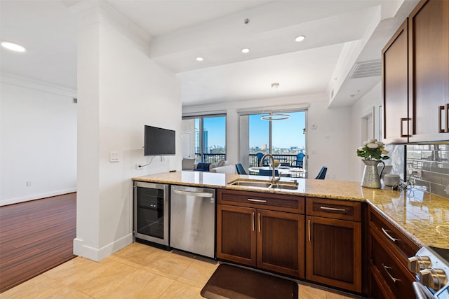 kitchen featuring beverage cooler, dishwasher, ornamental molding, a peninsula, and a sink