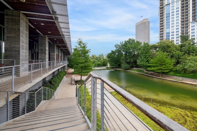 view of home's community with a water view