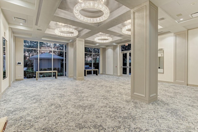 interior space featuring coffered ceiling and a chandelier