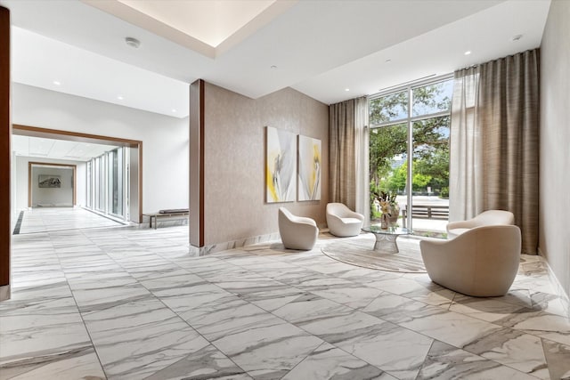 interior space with recessed lighting and marble finish floor