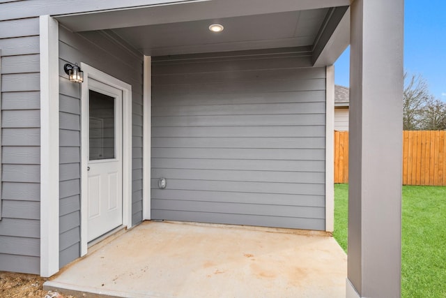 view of patio featuring fence