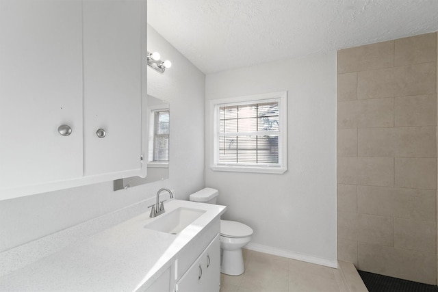 full bathroom featuring vanity, baseboards, tile patterned flooring, a textured ceiling, and toilet