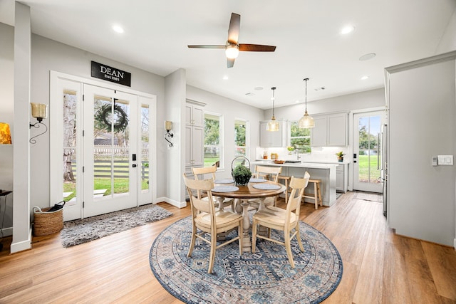 dining area featuring ceiling fan, recessed lighting, light wood-type flooring, and baseboards