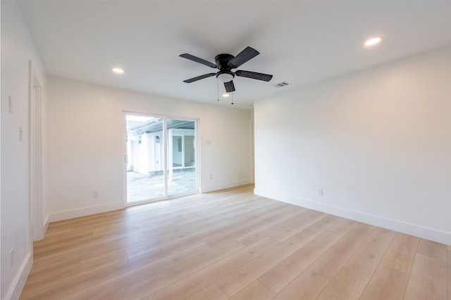 unfurnished room featuring recessed lighting, visible vents, and light wood-type flooring