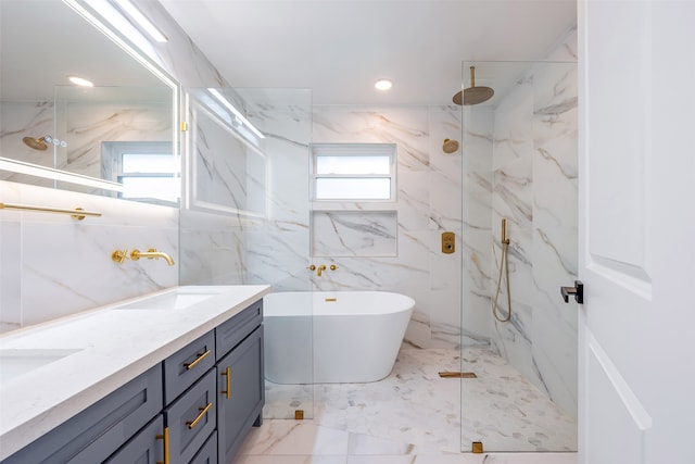 bathroom featuring a sink, a freestanding tub, a marble finish shower, and marble finish floor