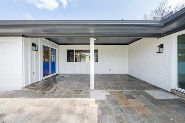 view of patio featuring an attached carport