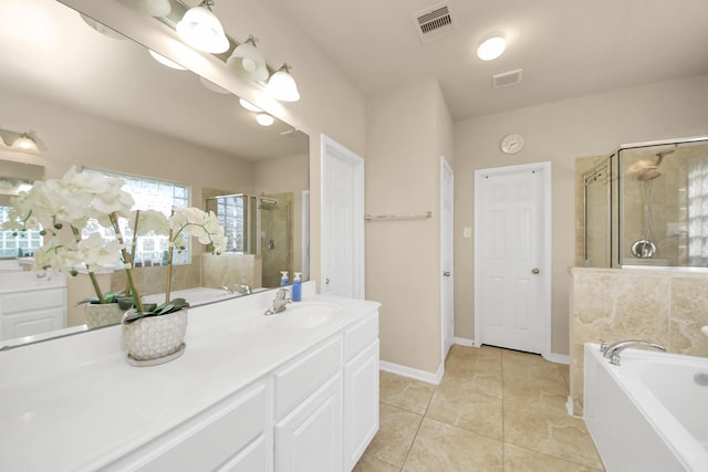 bathroom with visible vents, vanity, a bath, and a shower stall