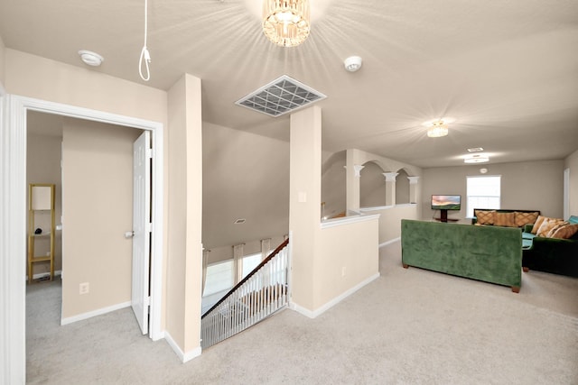 living area featuring baseboards and carpet floors