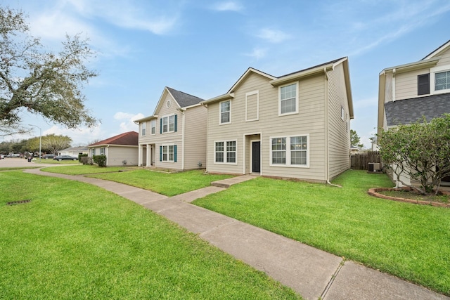 view of front of house featuring a front yard and fence